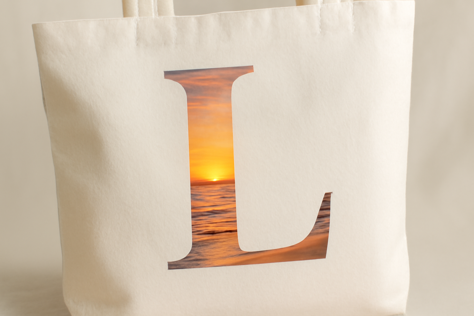 A single-letter photo monogram on a tote bag